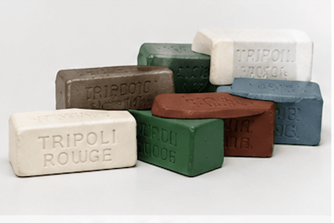Assorted buffing compound bars including Tripoli and rouge in cream, green, brown, and gray