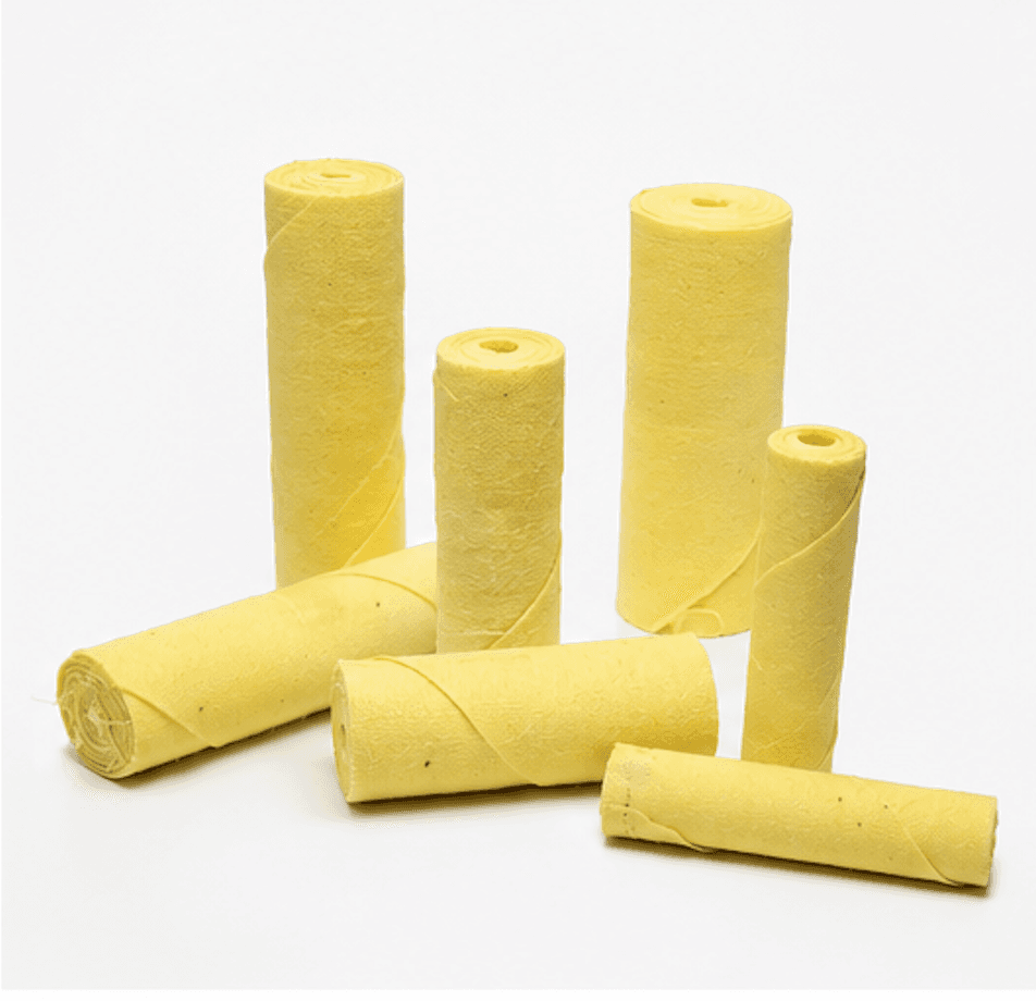 Yellow straight cartridge cloth rolls in multiple diameters and lengths on a white background